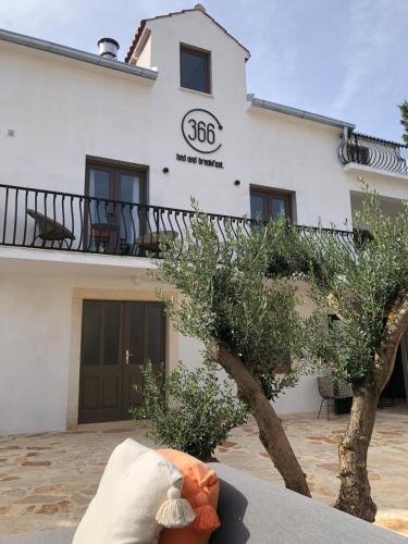 a building with the number on it at B&B 366 in Vrboska