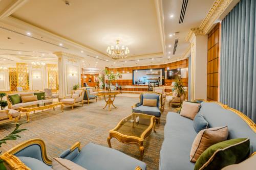 a lobby with couches and chairs and a table at Braira Al Jubail in Al Jubail