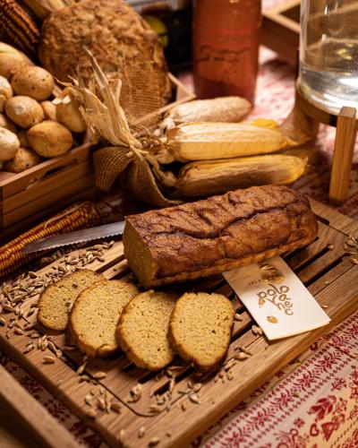 a table with bread and vegetables on a table at 5 Sunca in Kašina