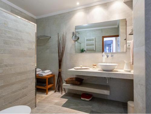 a bathroom with a sink and a mirror at La Isla del Júcar in Barraca de Aguas Vivas