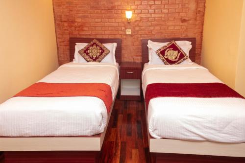 Postel nebo postele na pokoji v ubytování Budhanilkantha Sacred Trails Kathmandu Homestay