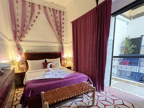 מיטה או מיטות בחדר ב-Riad Lazord