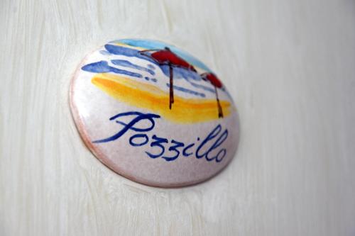 a button with a picture of a beach on it at Casa Vacanze Il Cenito in Castellabate