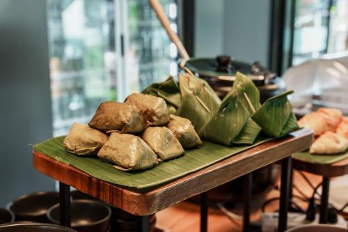 a table with a bunch of food on it at POR Arak in Chiang Mai