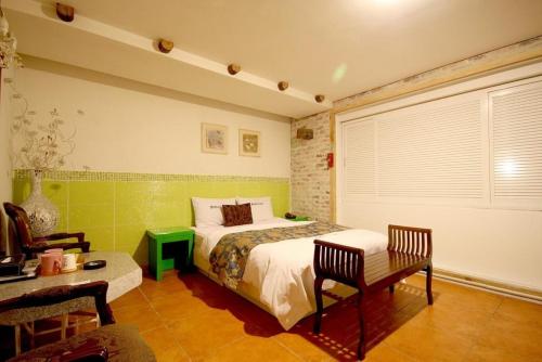Giường trong phòng chung tại Small Village of Inca Motel