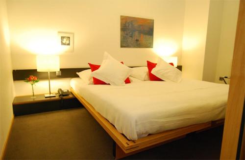 Ein Bett oder Betten in einem Zimmer der Unterkunft Hotel Central