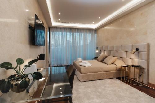 a living room with a couch and a window at 16 EXECUTIVE SUITES in Nicosia