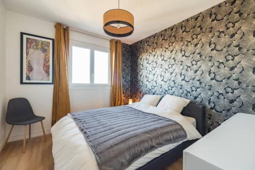 Säng eller sängar i ett rum på Spacieux appartement vue sur mer - Saint-Brieuc
