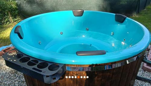 a blue tub sitting on top of a trash can at Glamping pod hradem in Česká Kamenice