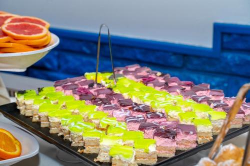 a large display of colorful desserts on a table at MPM Hotel Condor - All Inclusive Light in Sunny Beach
