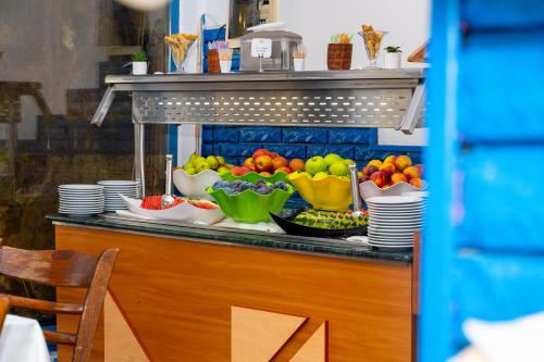 a buffet with fruits and vegetables in bowls and plates at MPM Hotel Condor - All Inclusive Light in Sunny Beach