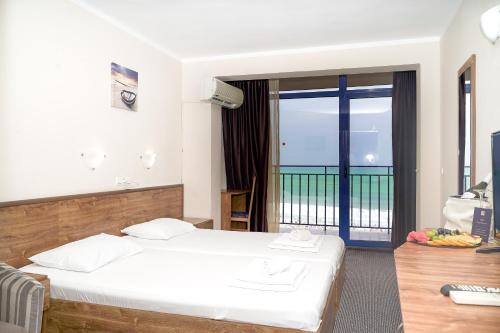 Postel nebo postele na pokoji v ubytování MPM Hotel Condor - All Inclusive Light