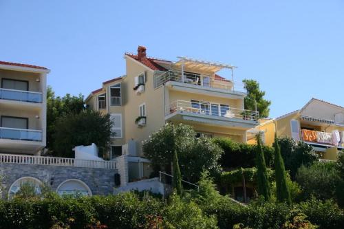 a building with balconies on the side of it at Apartments Boris in Omiš