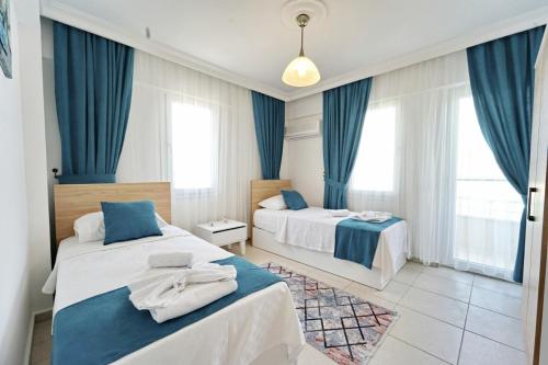 Un pat sau paturi într-o cameră la Villa Nehir