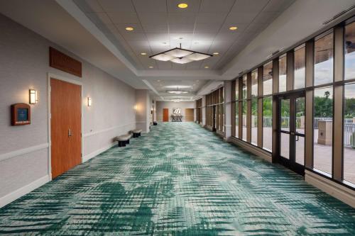 a hallway of a hospital with a green carpet at Hilton St. Petersburg Carillon Park in St Petersburg