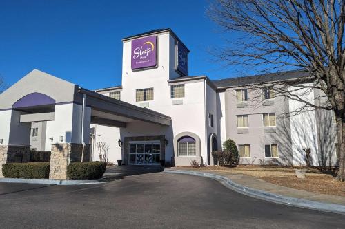 a large white building with a sign on it at Sleep Inn Pelham Oak Mountain in Pelham