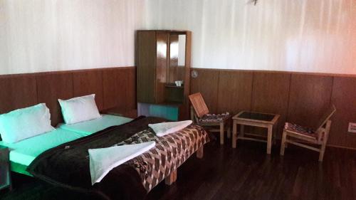 Una cama o camas en una habitación de Chubi Sponbo