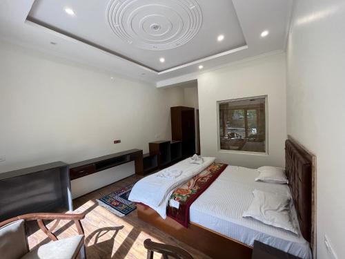 Una cama o camas en una habitación de Chubi Sponbo