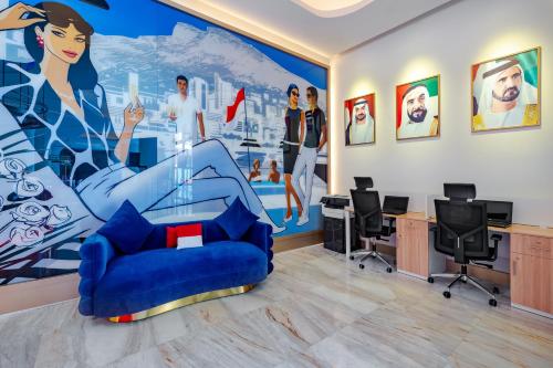 an office with a large painting on the wall at voco Dubai Monaco, the Heart of Europe by IHG in Dubai