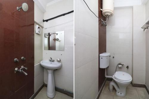 a bathroom with a toilet and a sink at Oyo Hotel Luxury Inn Near Dhaula Kuan Delhi in New Delhi