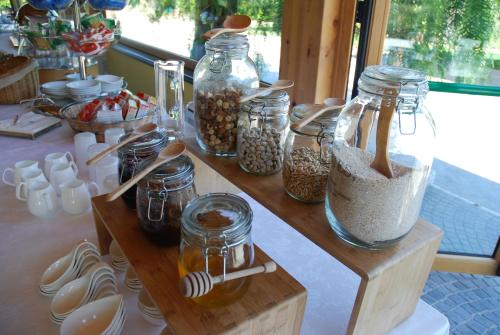 a table with jars of food and other items on it at Four Points Flex by Sheraton Naples Marigliano in Marigliano