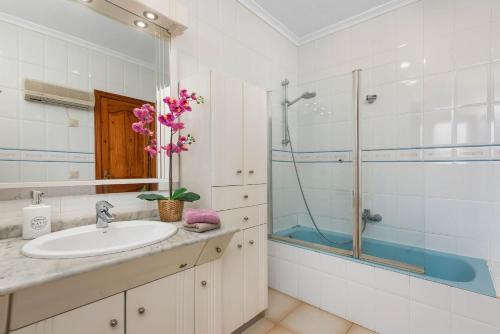 a bathroom with a sink and a shower at Villa Escudero - Plusholidays in Calpe