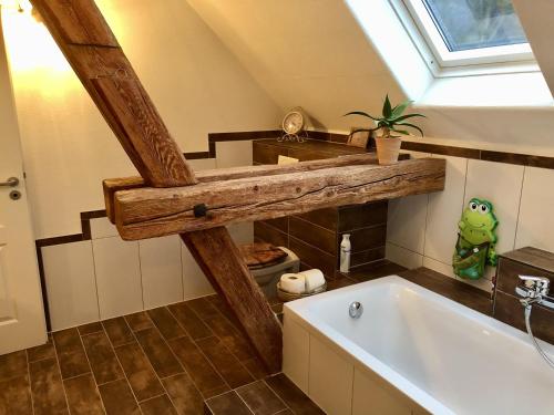 a bathroom with a sink and a bath tub at Eschachblick in Zimmern ob Rottweil