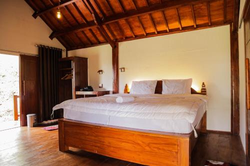 Postel nebo postele na pokoji v ubytování Nea Cottage Lombok