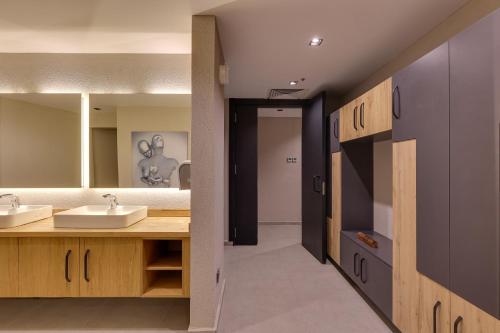 a bathroom with two sinks and a large mirror at Celeste Bella Luxury Hotel & Spa in Ortakent