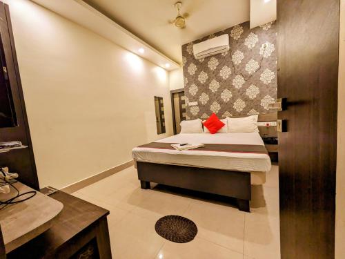 a bedroom with a bed in a room at HOTEL SUN CITY in Puri