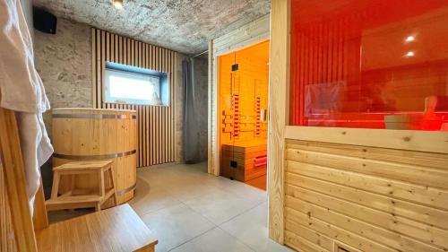 a bathroom with a shower and a tub in a room at Gojka Apartamenty in Piekielnik