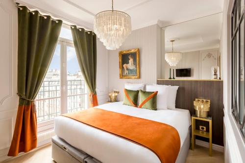 a bedroom with a large bed and a large window at Luxury 7 bedrooms & 5 Bathrooms Monument View Terrace -Champs Elysées in Paris