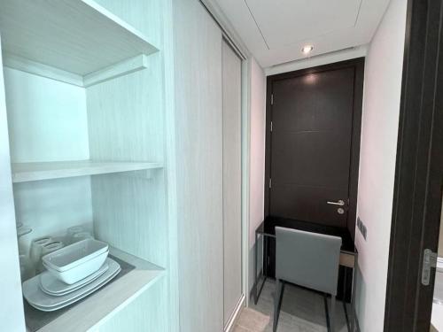 a small bathroom with a toilet and a sink at Direct pool access studio Twin Sands by Lofty in Patong Beach