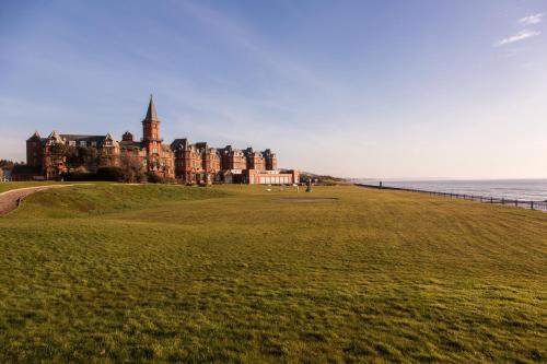 a large castle on the shore of the ocean at Slieve Donard in Newcastle