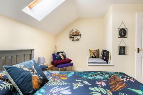 a bedroom with a bed with a blue comforter at Modern 3 bedroom home *EVcharging* Garden, Parking in Darlington
