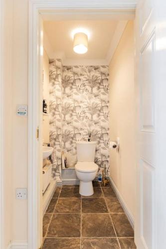 a bathroom with a toilet and a sink at Modern 3 bedroom home *EVcharging* Garden, Parking in Darlington