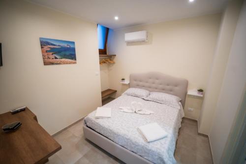 Postel nebo postele na pokoji v ubytování B&B La Dimora di Pepè