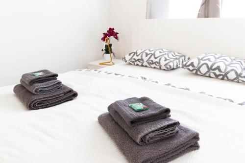 two towels sitting on top of a bed at Märzstraße Apartment in Vienna