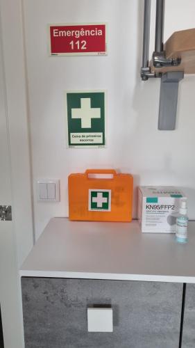 an orange box sitting on a table in a hospital room at Katyto house in Costa da Caparica