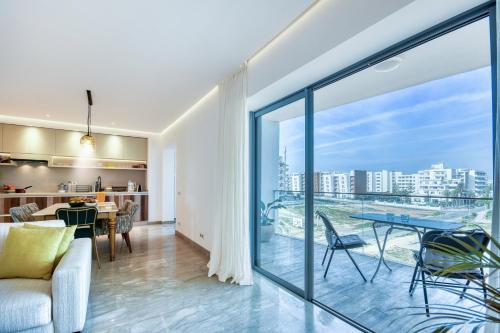 a living room with a view of the city at Jad - Luxe - piscine - 6 Px in Agadir