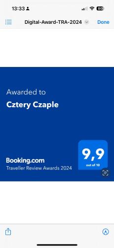 Cztery Czapleに飾ってある許可証、賞状、看板またはその他の書類