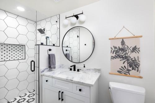 a bathroom with a sink and a mirror at Scottsdale Vacation Rentals in Phoenix