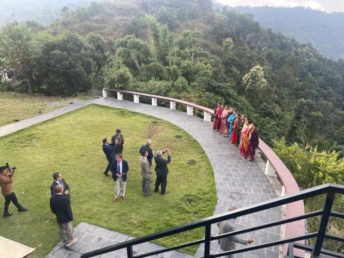 a group of people standing on a bridge at Hotel Pokharaeye in Pokhara