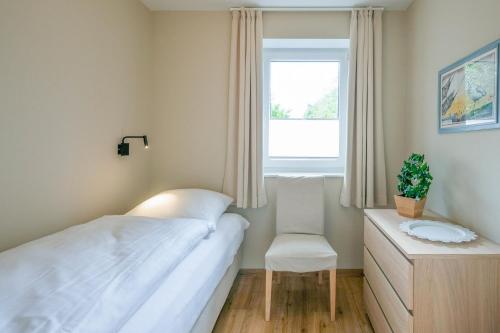 Ένα ή περισσότερα κρεβάτια σε δωμάτιο στο Regenbogen