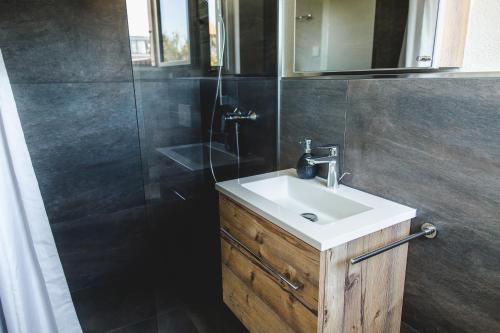 a bathroom with a sink and a shower at Natalies Hideaway in Thun