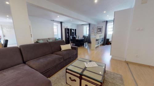 a living room with a couch and a table at COLMARAPPART Grand'Rue in Colmar