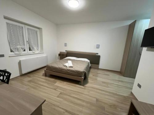 Postel nebo postele na pokoji v ubytování B&B La Terrazza Polifrone