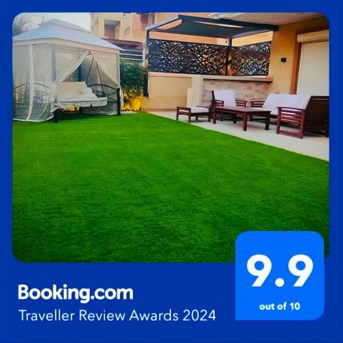 a picture of a lawn with a gazebo at شقة فاخرة 3 غرف نوم و حديقة خاصة في الشيخ زايد - Zayed Suites A in Sheikh Zayed