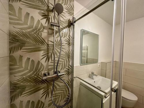 a bathroom with a shower and a sink at Sava View 8 in Ribno