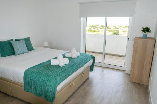 Postel nebo postele na pokoji v ubytování Baleal Dream